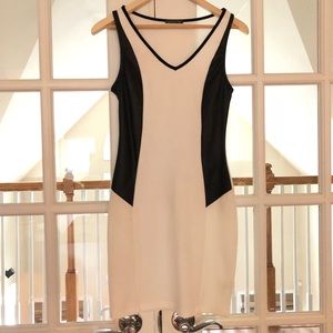 White mini dress with black pleather detail.